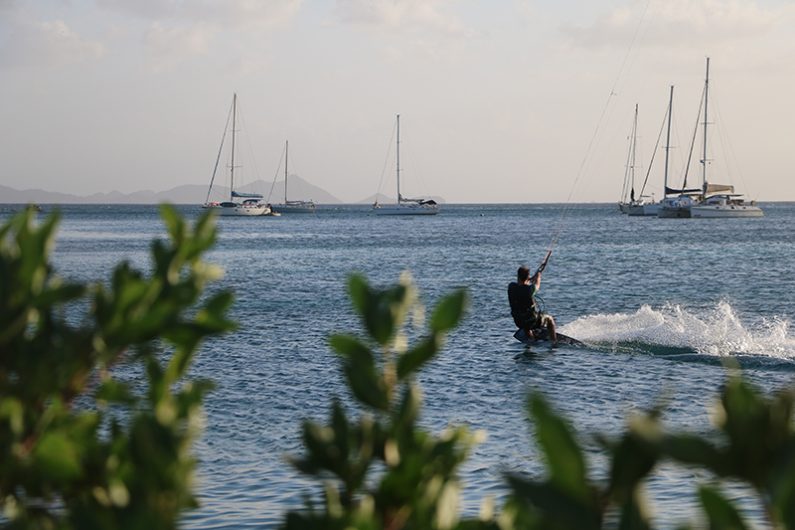 Kiting just next to where we are anchored 795x530 - Two kiters living the dream… not rich, not pros