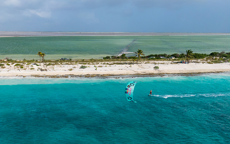 Lasse Walker with the pink salt ponds in the back shot by Arnaud Plas Fly Media Productions - Yndeleau - Kiting and sailing the world - Bonaire