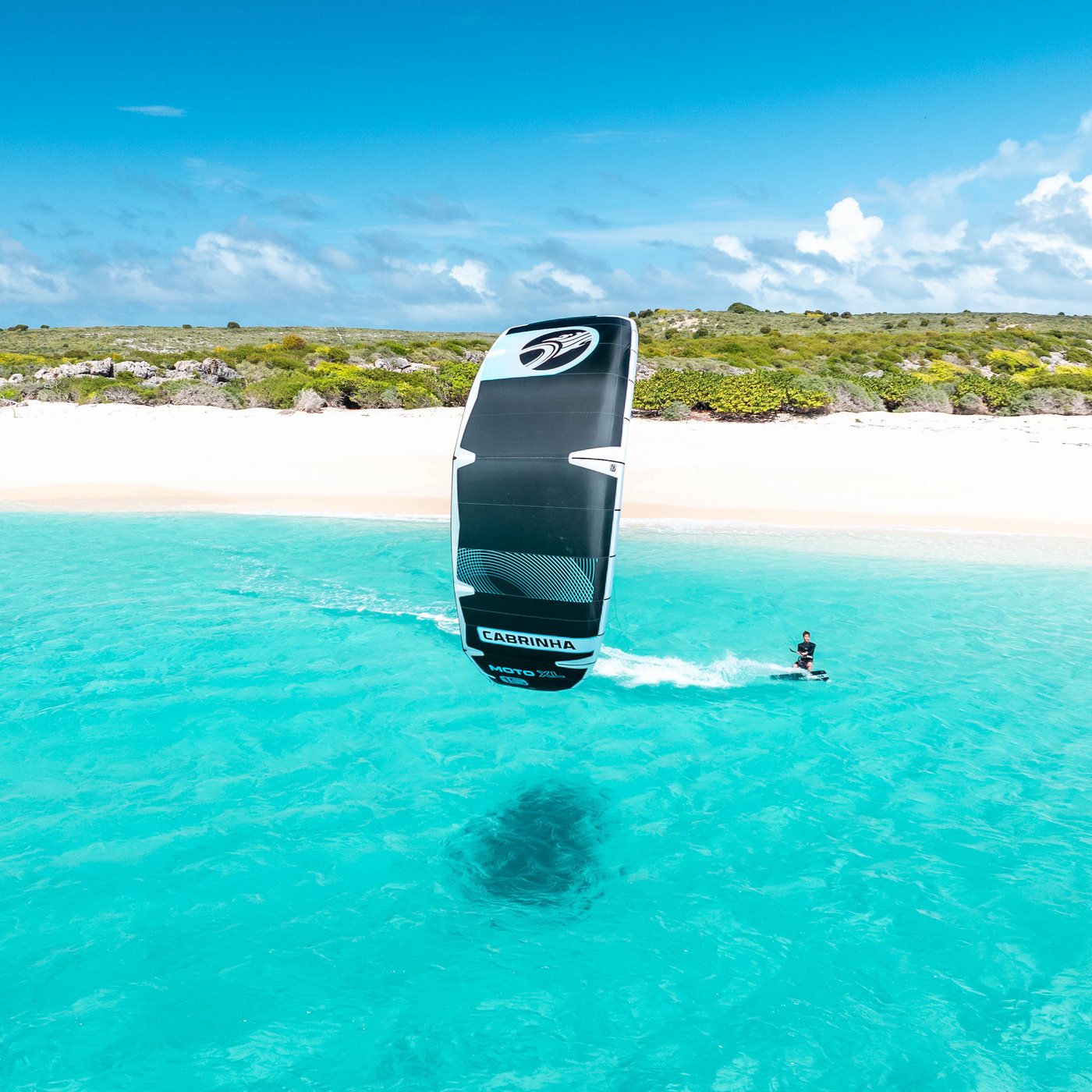 Kiter riding over turquoise water
