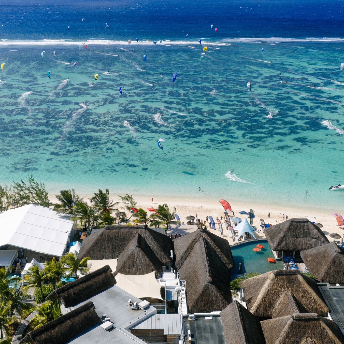 Kiter on flat turquoise water